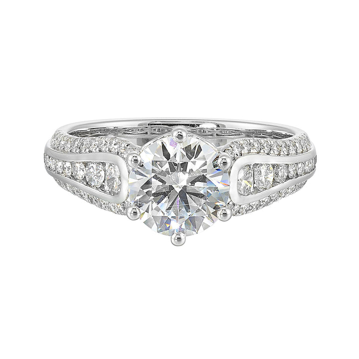Stunning solitaire ring set in 6 prongs is a dazzling display of channel set diamonds in the center & pave on sides making the ring more appealing.