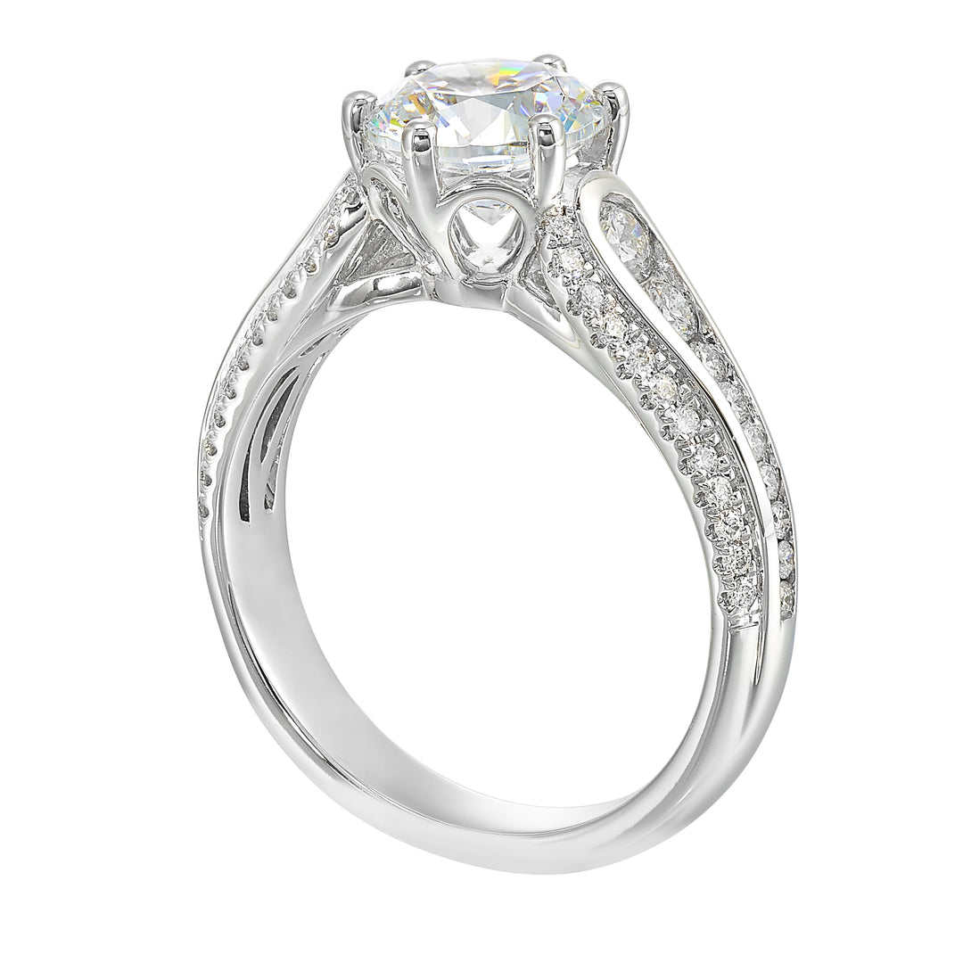 Stunning solitaire ring set in 6 prongs is a dazzling display of channel set diamonds in the center & pave on sides making the ring more appealing.